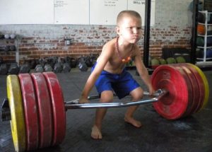 little-kid-lifting-trap-bar-deadlift